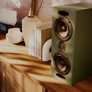 Krix - Acoustix Evara - Bookshelf Speakers Australia Studio Green finish on a sideboard