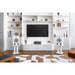 Triangle - BR05 - Bookshelf Speakers Australia Frosted White pair on white S03 stands either side of a TV unit