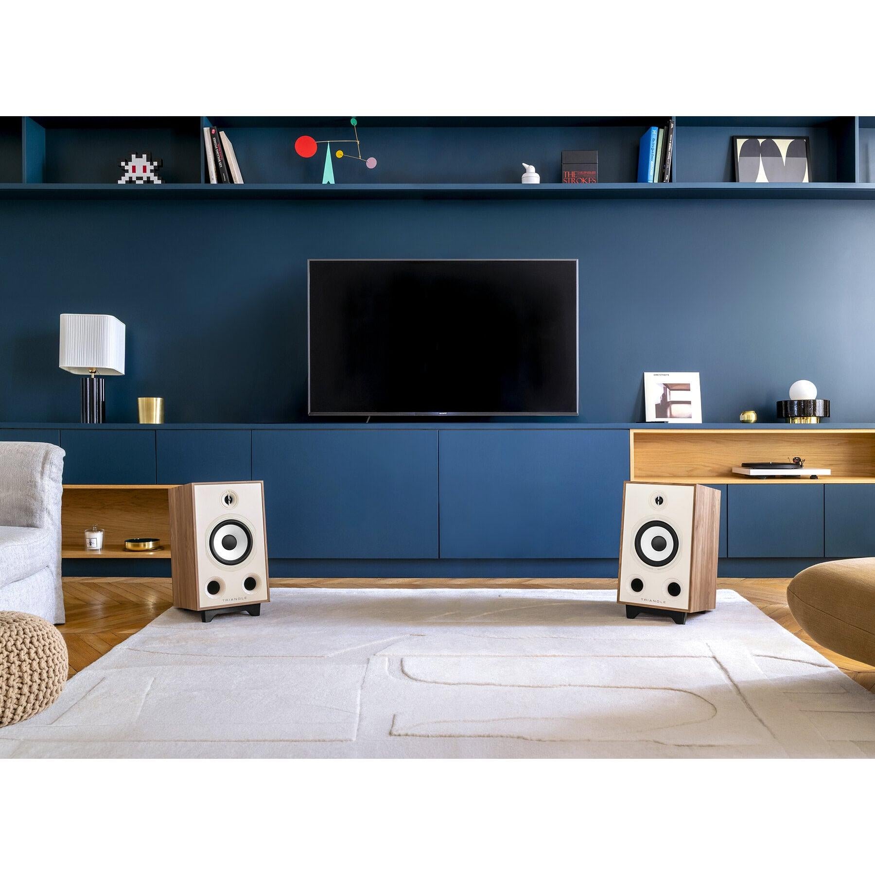 Triangle - BR05 - Bookshelf Speakers Australia Light Oak pair on the supplied bases in a living room