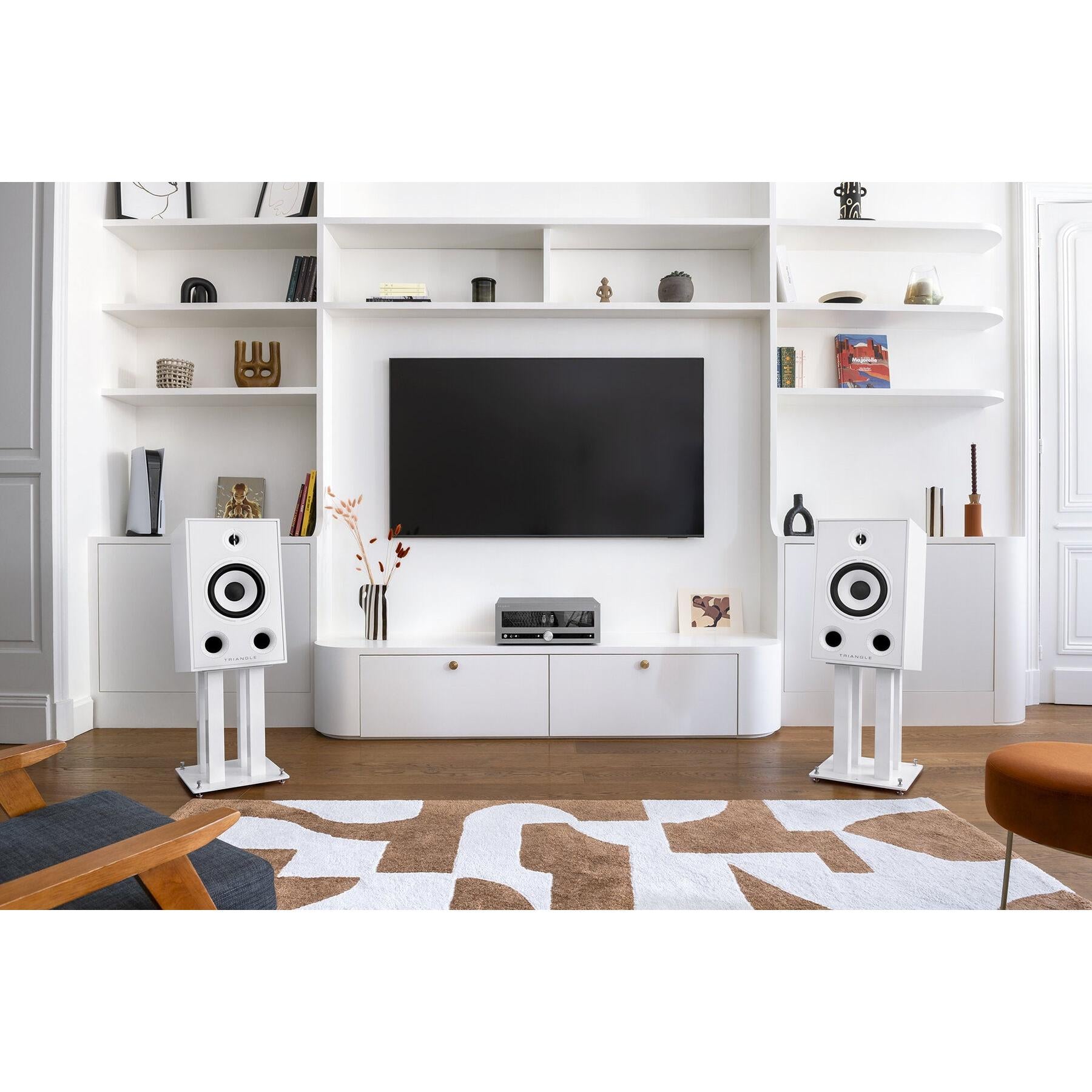 Triangle - S03 - Speaker Stands Australia White pair with Borea BR05 speakers (sold separately) either side of a TV unit