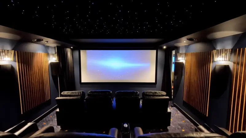 A dedicated home cinema by Sydney Hi-Fi, with timber acoustic panels and a starfield ceiling